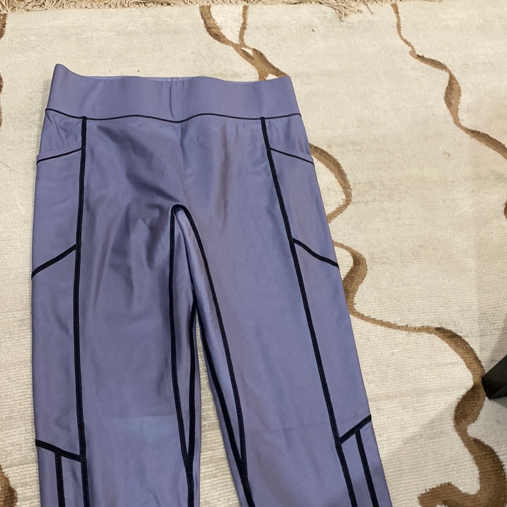 Holographic purple AllAccess leggings with black designs on sides